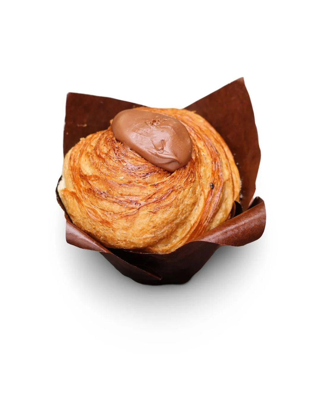 Round laminated pastry topped with chocolate cream on a white background